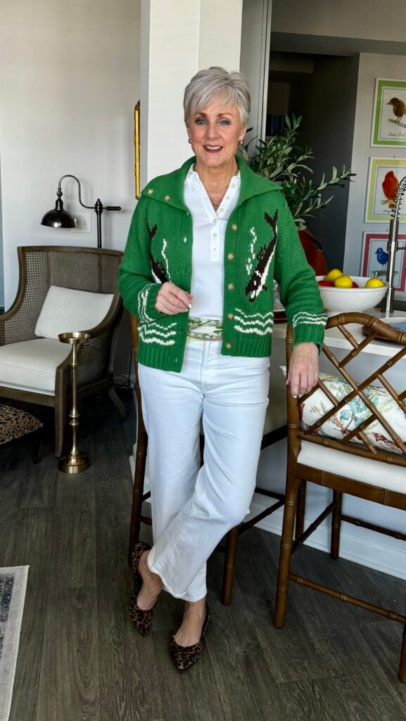 Green cardigan with a white tee, white jeans, and a silk scarf