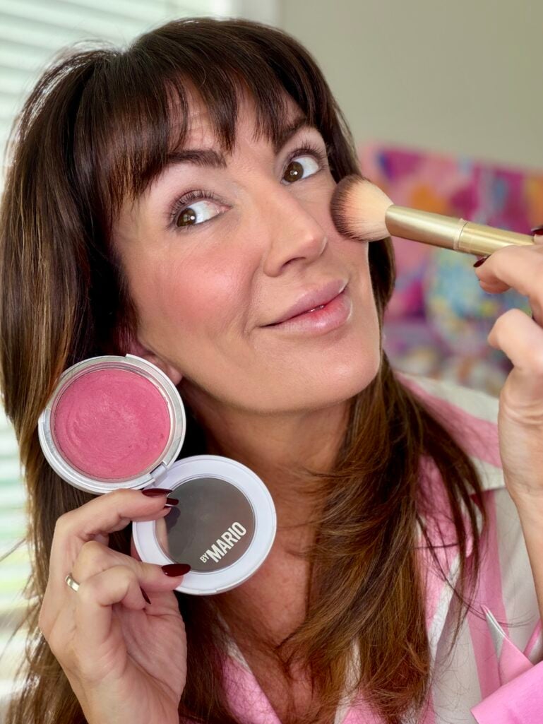 Cream blush applied high on cheeks