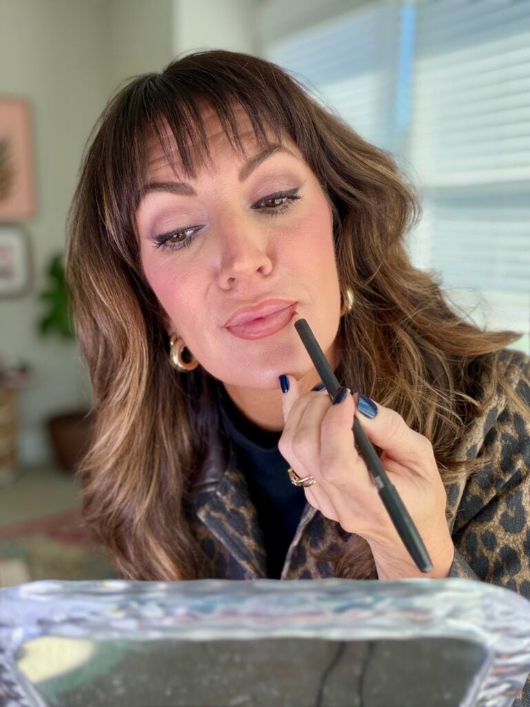 jennifer applying lip liner