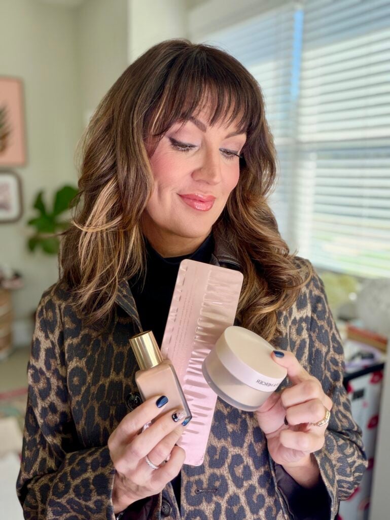 jennifer holding beauty products