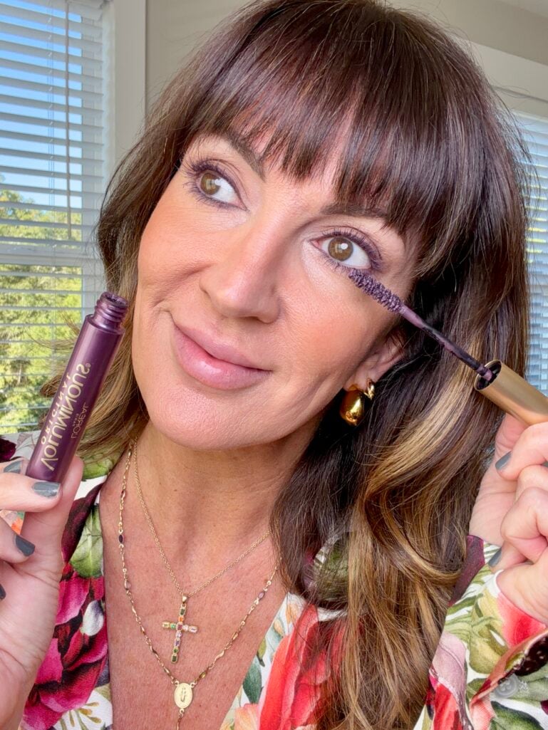 applying purple mascara